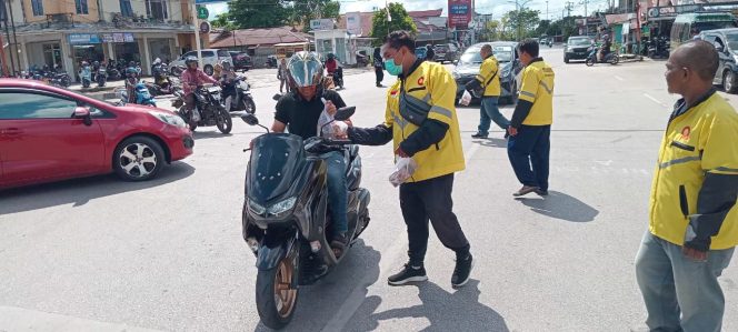 
 Polres Paser dan Komunitas Ojol Maxim Ajak Warga Tertib Berlalu Lintas